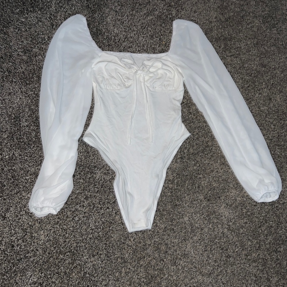 white bodysuit with sheer sleeves